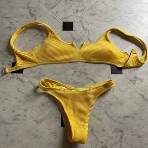 from hollister bathing suit yellow top is a small and bottoms are x small
